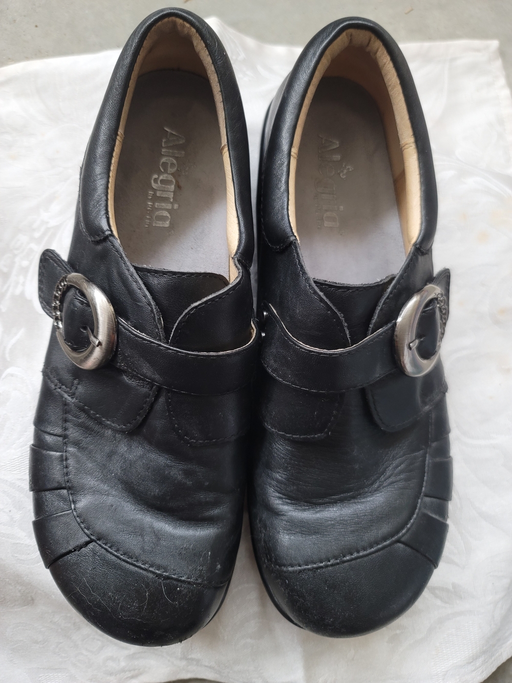 Alegria Black Leather Slip-On Shoes with Silver Buckles